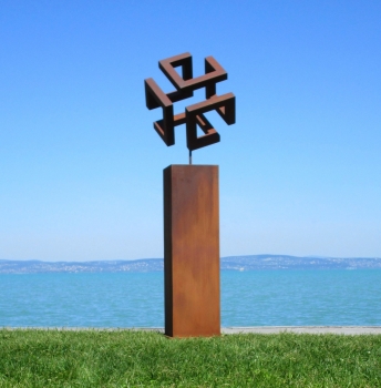 Rusty cube on column artwork